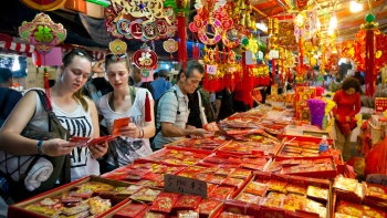 Chinese New Year - Chinatown booths with decoration materials and red packets
