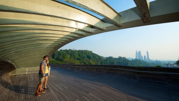 A couple at the Henderson Waves bridge looking at the scenery