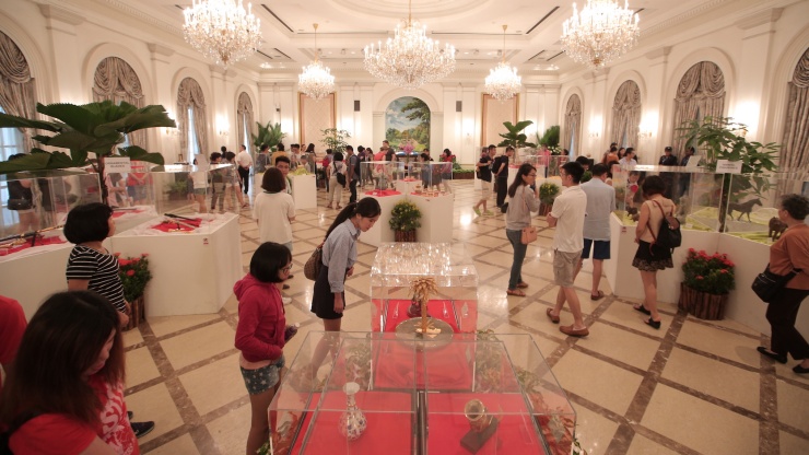 Members of the public at an exhibition within the Istana