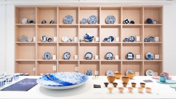 Designer porcelain plates and pottery on display