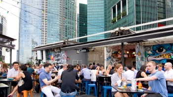 Daytime outdoor scene of people drinking at kinki Restaurant + Bar Collyer Quay